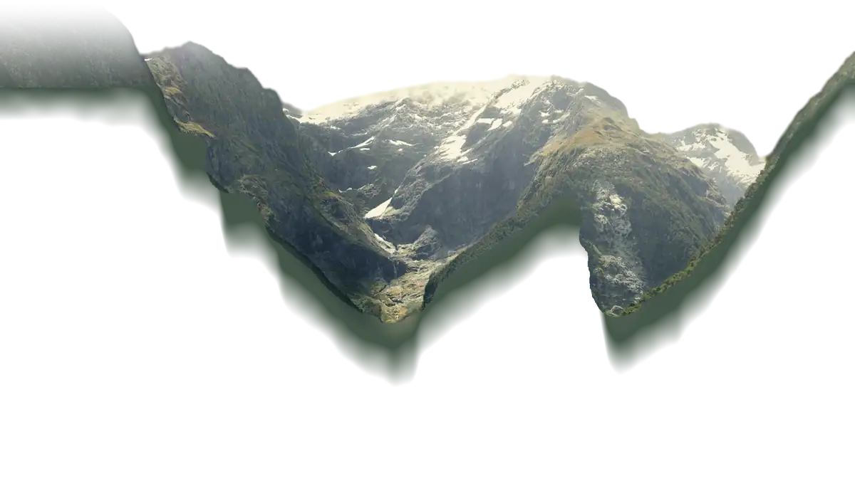 Milford Sound in Fiordland: forested walls rising either side of the fiord to a snow-capped peak, with a tall ship on the water